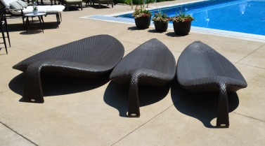 Three pool lounge chairs look like leaves.